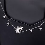 Elegante Perlenkette aus Kupfer mit Stern und Mond – Bild 2