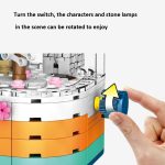 601077 Cherry Blossom Series Transparentes Licht Rotierende Box Puzzle Zusammengebautes Spielzeug Kleine Partikelbausteine – Bild 3